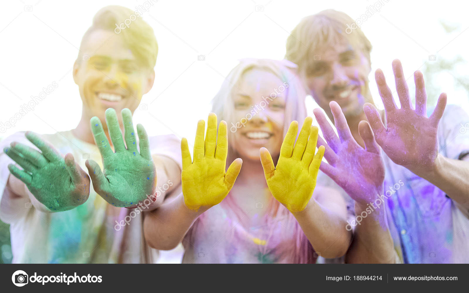 Happy young people showing colorful palms to camera, charity event promotion
